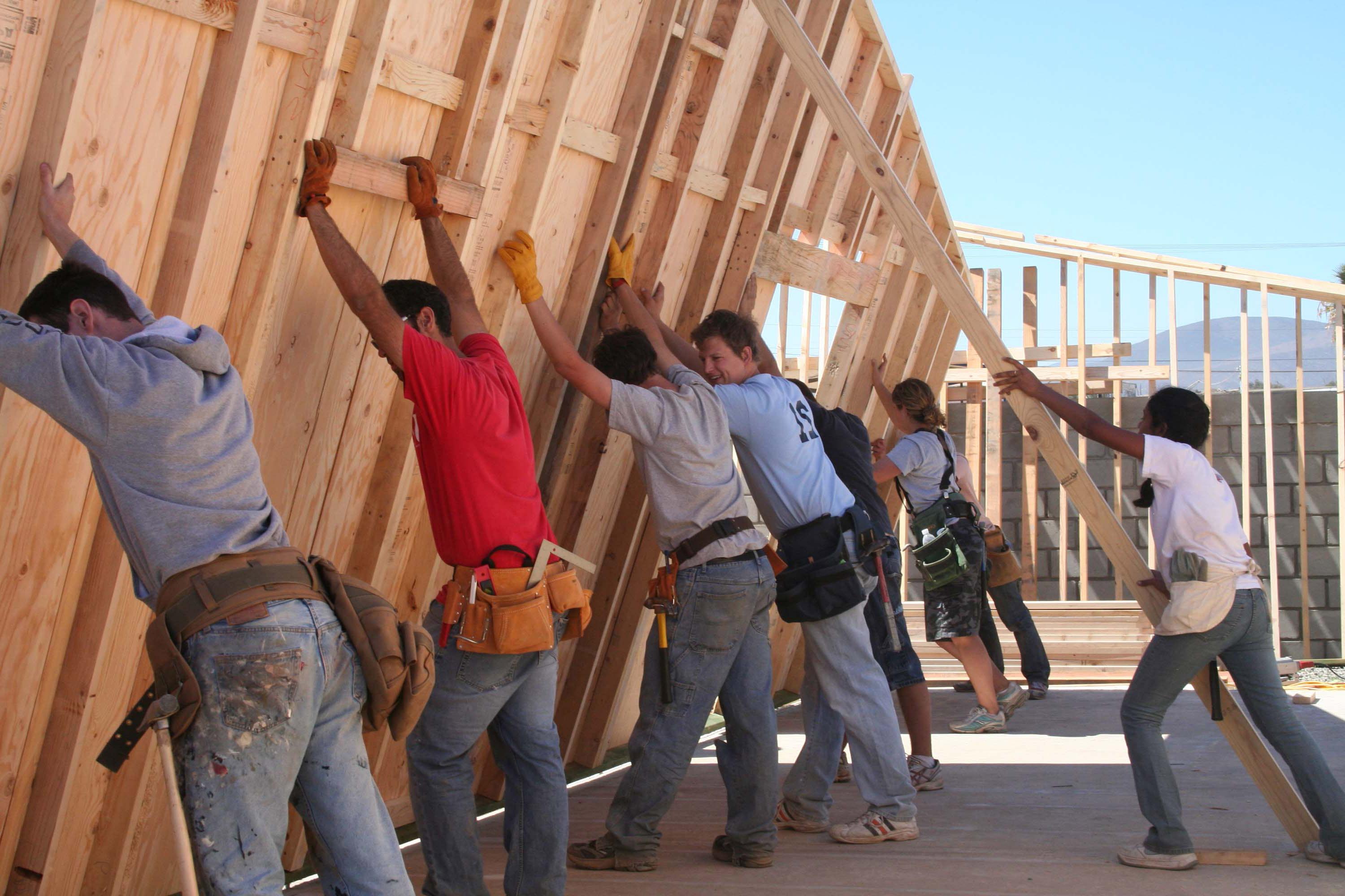 Potter's Clay workers putting up a wall